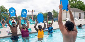 students in the learn to swim program in pool on UNCW campus