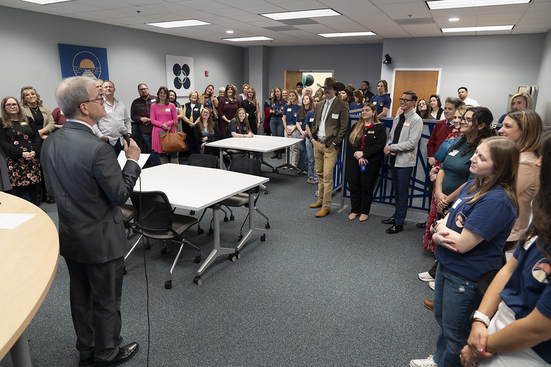 A crowd of people gathering to celebrate the opening of the Applied Learning Classroom.