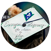 grad cap with "Everyone deserves to fly"