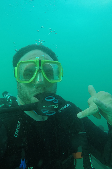 Alum in scuba gear under water