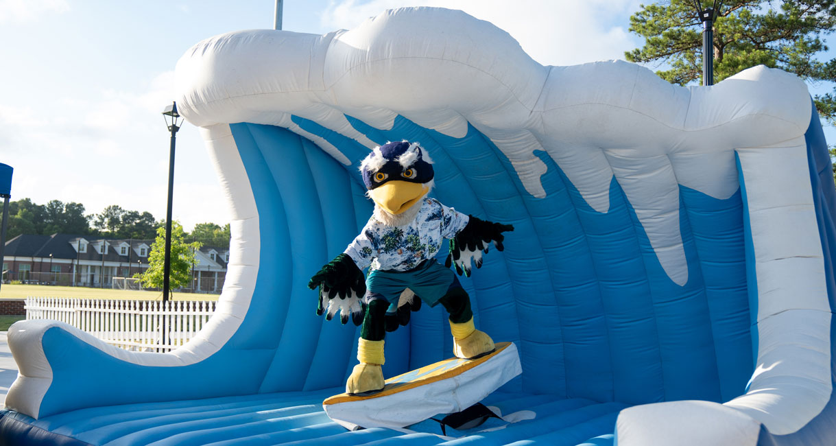 students cheering at wave flume boat race