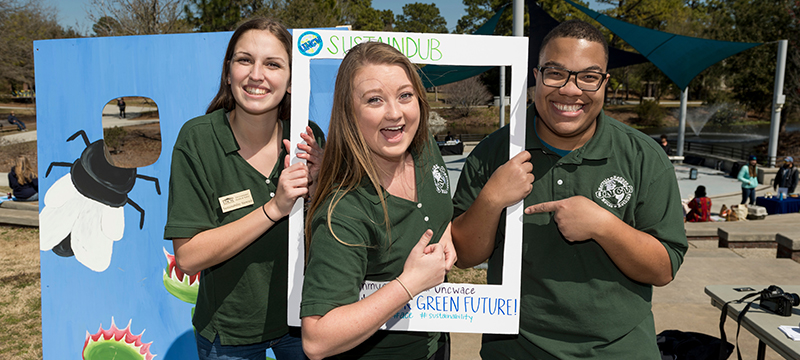 Students showing off UNCW's sustainability initiatives