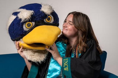 Skylar Spencer holding Sammy C. Hawk costume head